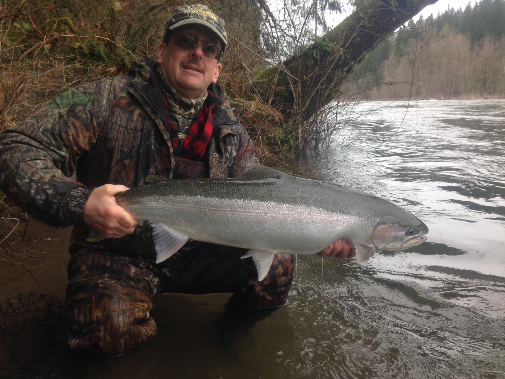 john with fish at river.jpg