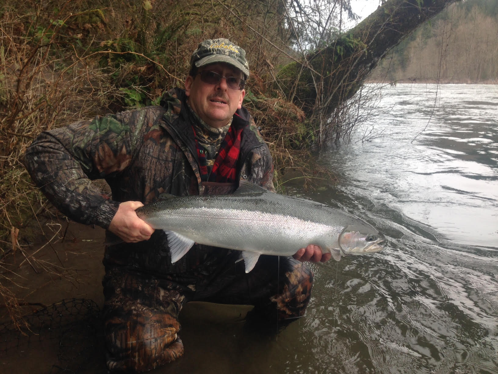 John with Fish at river2.jpg