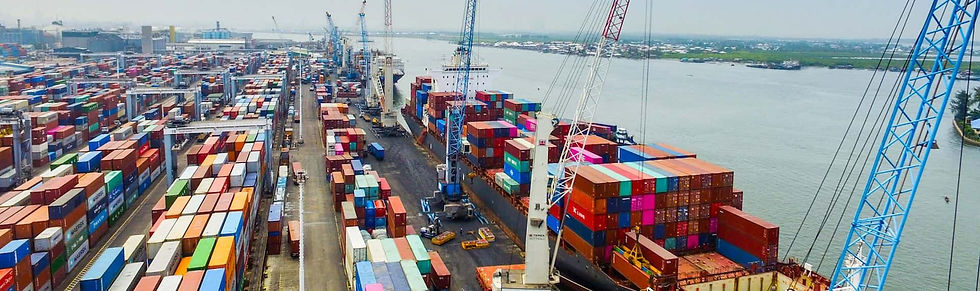 Container terminal with cranes and stacked shipping containers