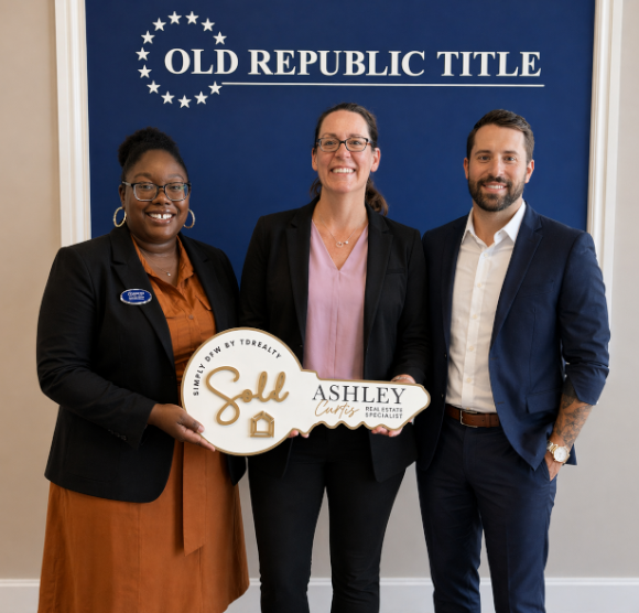 Coach Barbara Zinda receives the keys to her new home, celebrating a move for a career promotion.