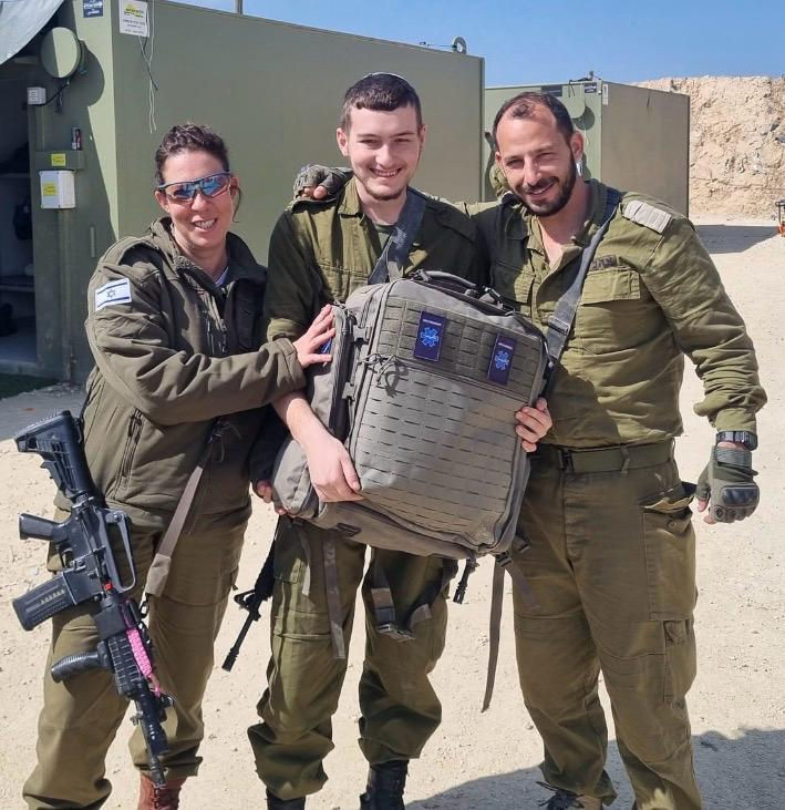 medic receives trauma backpack filled with gear.jpeg