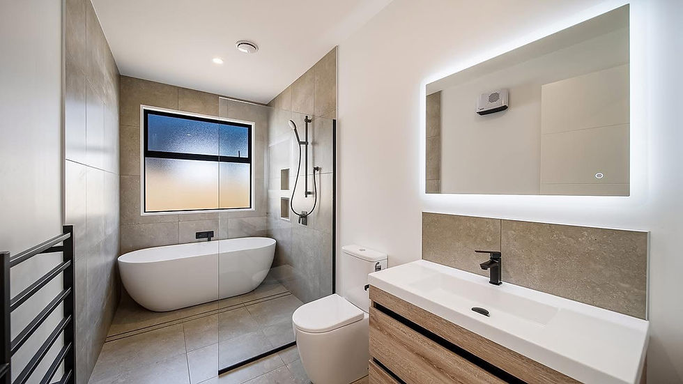 Contemporary bathroom built by Kian Clements-Ormond featuring freestanding tub and LED mirror