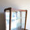 Thumbnail: Mid-Century Display Cabinet With Gold Trimmings on brass capped feet