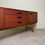 Thumbnail: Mid-century UK Avalon sideboard in teak with shaped half-moon teak handles