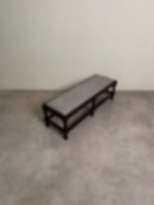 Antique low bench, newly upholstered and resting on four bobbin legs