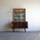 Thumbnail: Mid-Century Display Cabinet With Gold Trimmings on brass capped feet