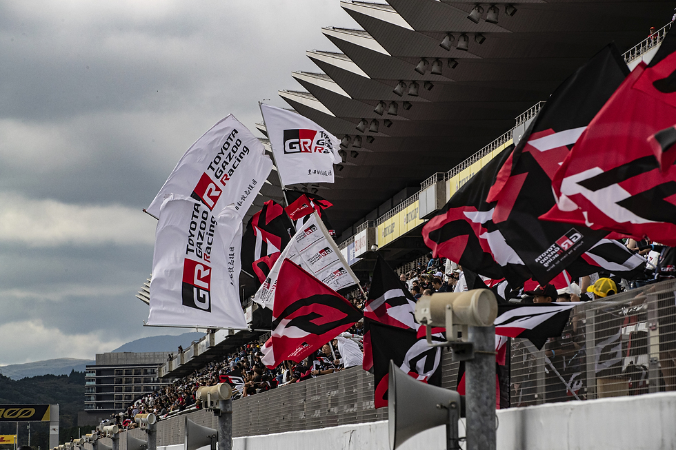 Toyota fans cheering for their team in one of the grandstands at Fuji Speedwaywith flags | Credit: Toyota Gazoo Racing