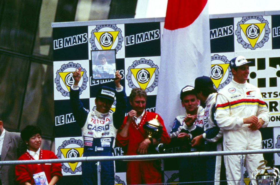 Sekiya lifting a photograph of Ogawa on the '92 24 Hours of Le Mans podium | Credit: Toyota Gazoo Racing