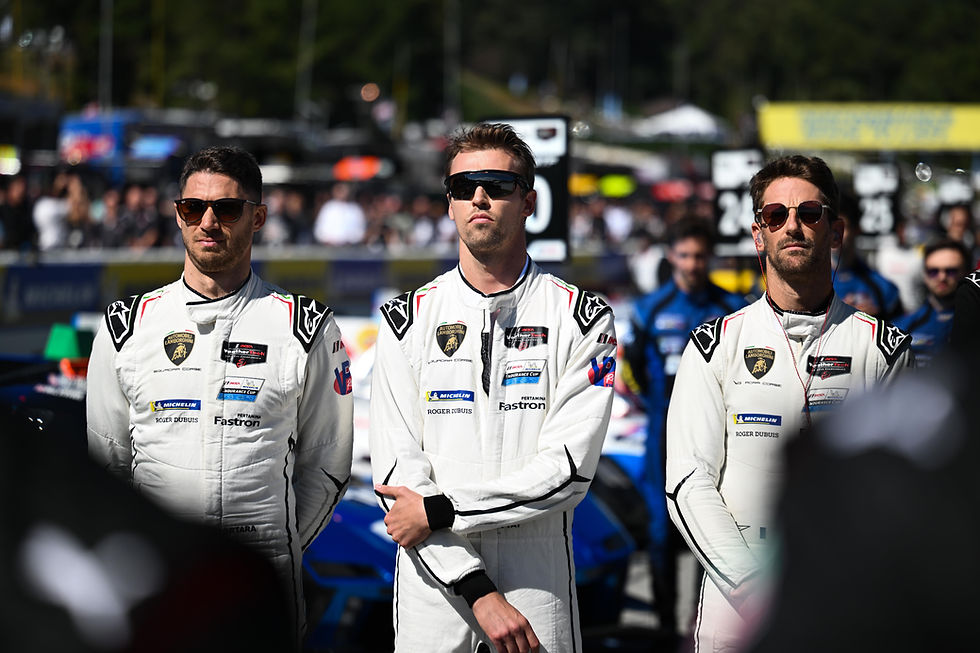 The No.63 Lamborghini drivers in white racing suit and sunglasses. L-R: Edoardo Mortara, Daniil Kvyat and Romain Grosjean | Credit: Lamborghini Media