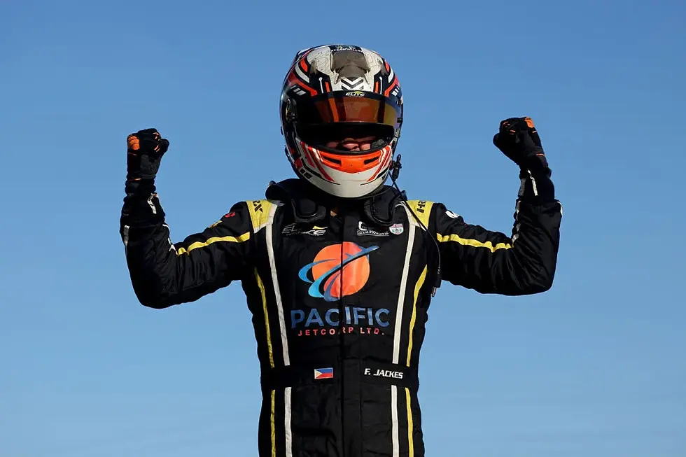 Man celebrates by striking a victory pose