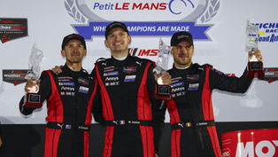 The No.6 Porsche Penske Motorsport drivers on the podium at Road Atlanta (L-R: Matt Campbell, Mathieu Jaminet, Laurens Vanthoor) | Credit: Porsche Newsroom