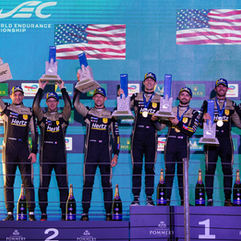 Credit: Cadillac Racing | The Cadillac JOTA drivers and a crew member celebrating Cadillac's maiden victory in São Paulo.