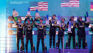 Credit: Cadillac Racing | The Cadillac JOTA drivers and a crew member celebrating Cadillac's maiden victory in São Paulo.