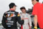 Credit: Super Formula | Ohta (centre) being congratulated by Iwasa (left) and team boss Muraoka (right)