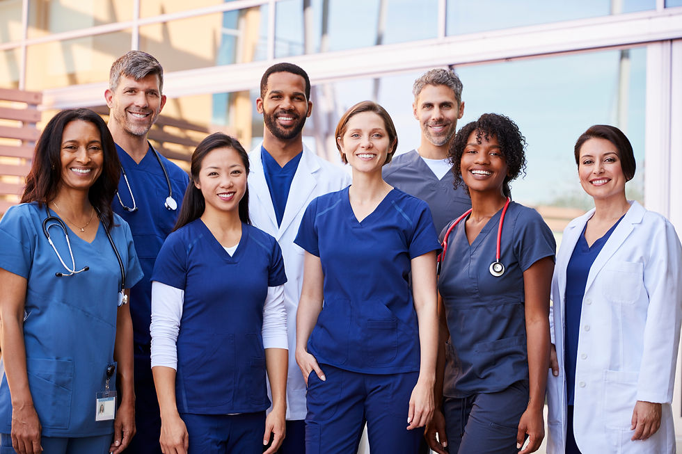 smiling-medical-team-standing-together-outside-a-h-2023-11-27-04-59-58-utc.jpg