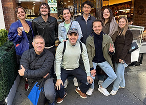 Tom with a group of guests in front of Ferrara Bakery in Little Italy, New York City