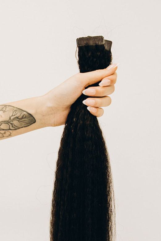 Close-up of kinky straight Remy tape-in texture