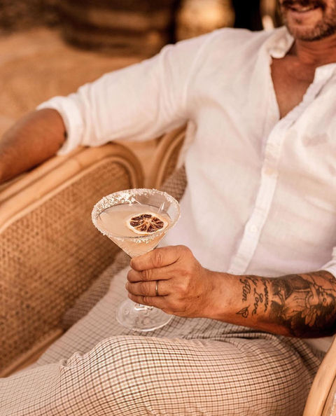Drinking Margarita cocktail from boho-rustic mobile bar
