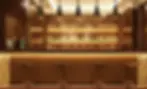 Elegant wood bar with stools and lit bottle shelves