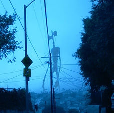 Cover for Creepypasta column by Jamie L. Depicts sirenhead in the distance.