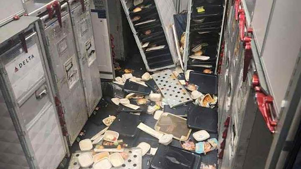 Plane service carts, food items thrown about after turbulence onboard Delta Flight 56. Obtained by KSTU