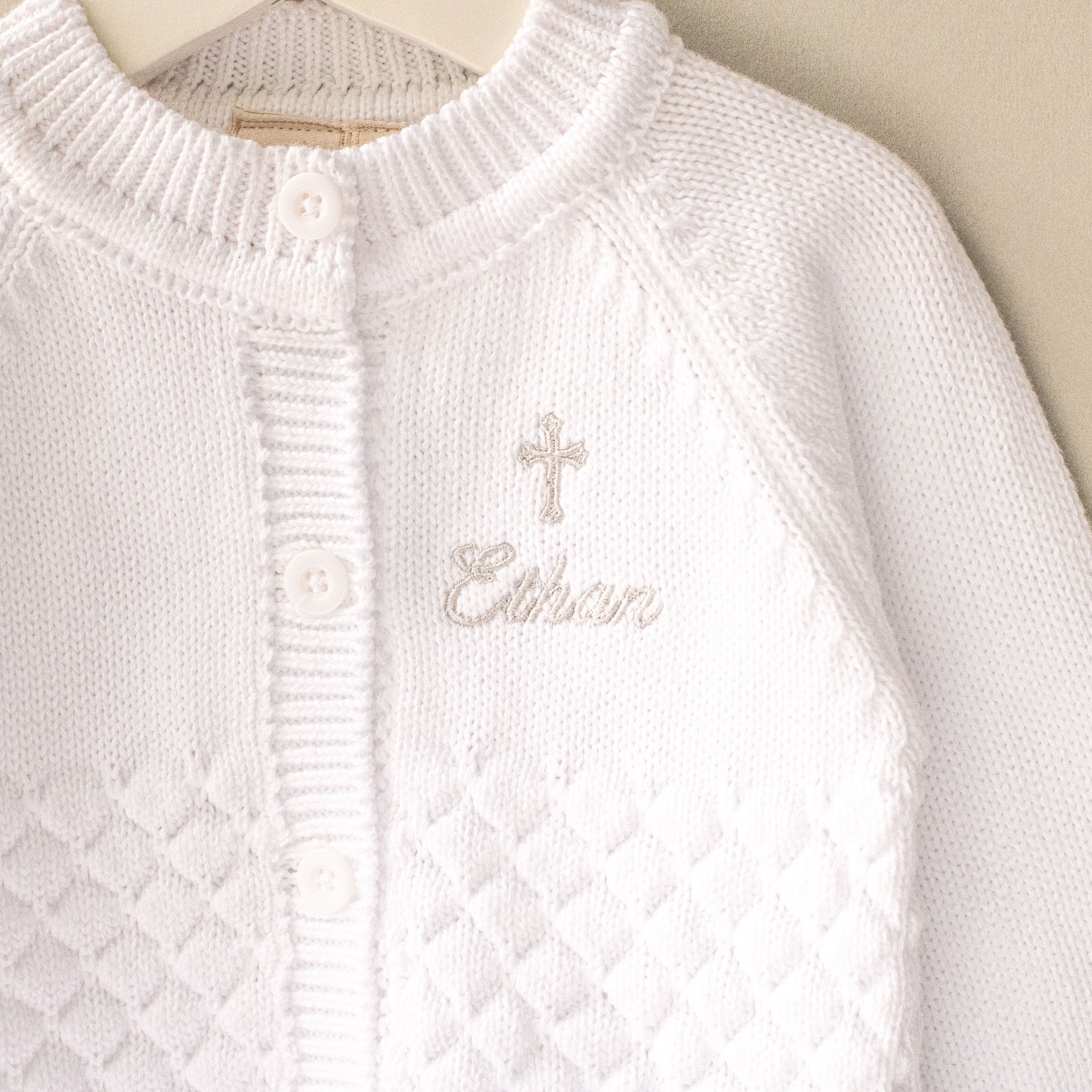 Personalised White Pebble Christening Cardigan with Gothic Cross close up