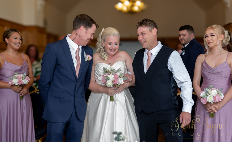 a bride is walking down the aisle with her parents