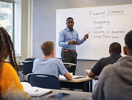 An educator teaching financial literacy to graduating seniors.
