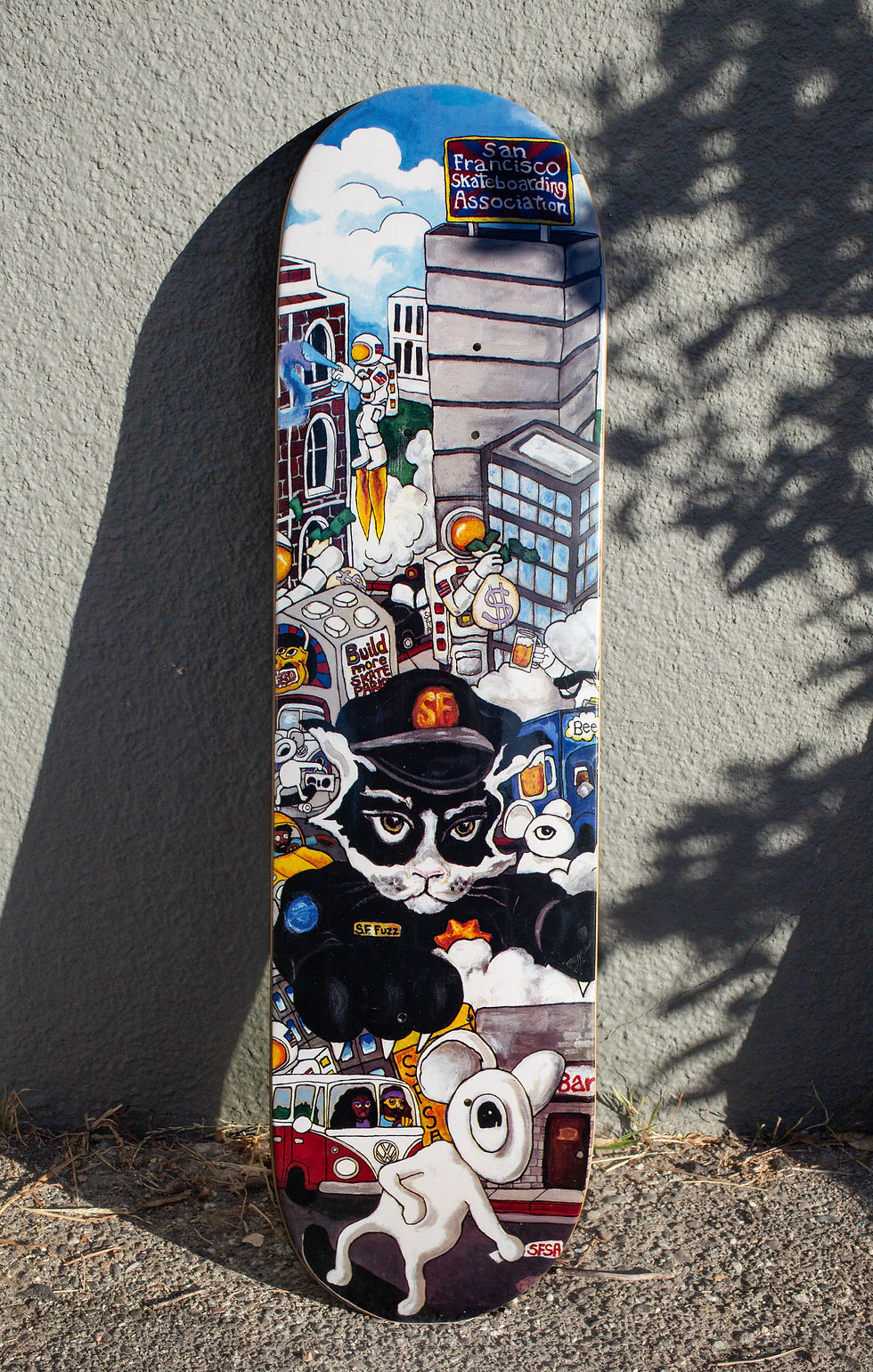 surrealist pop punk art on the bottom of a skateboard deck by Kip Westerfield