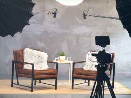 Two-chair interview setup lit and ready to film in a London studio