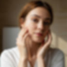 Example of an AI-generated skincare advertisement image featuring a woman in soft light, demonstrating realistic ad visuals created using AI.