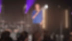 Event highlight video filming at live Brighton conference with stage lighting and audience
