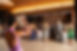 A photo of Tanie leading a group dance at a fundraiser gala. 