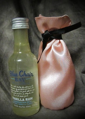 Mini wine bags are a great idea as a wedding favor. What a great little way to stay in your wedding theme and it's now an heirloom. These can be more personalized as well, of course. Michele's Art & Apparel