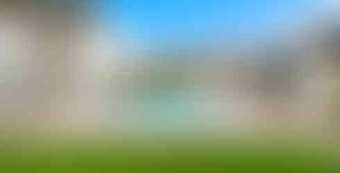 outdoor pool in the center of an orange county home and covered patio