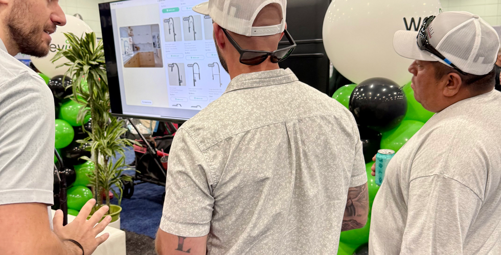 People looking at a digital display at the Build Expo USA