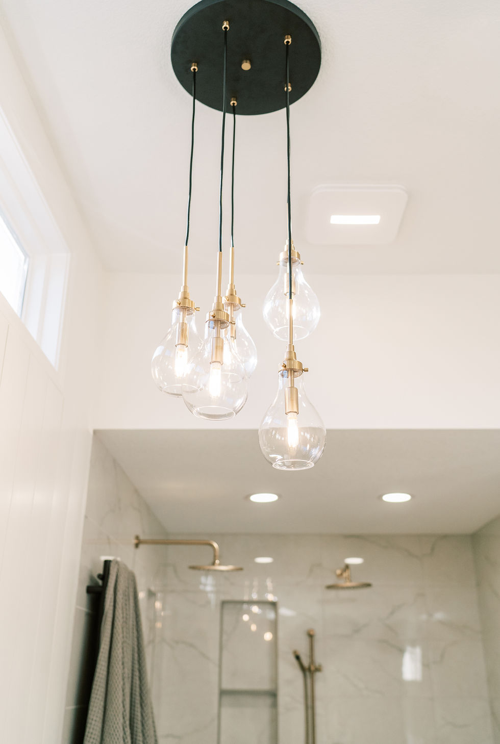 light fixture hanging in bathroom remodel