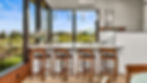 Barstools placed below countertop in kitchen
