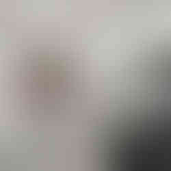 Custom kitchen with stainless steel sink and white cabinets with white countertops