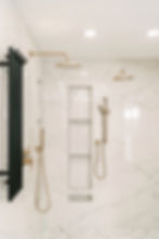 updated bathroom with shelved install in and gold water fixtures