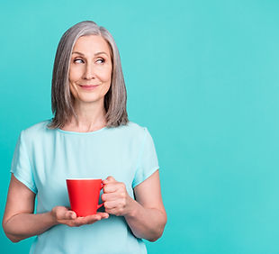Portrait of calm peaceful smiling dreamy grandmother look copyspace drinking tea isolated