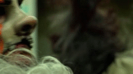 Wolf Cop gif, the Wolf Cop points his revolver at a burglar and roars