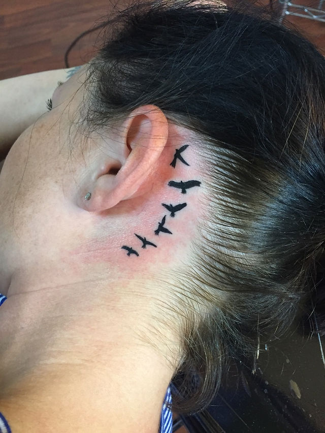 Bird Silhouettes Behind Ear