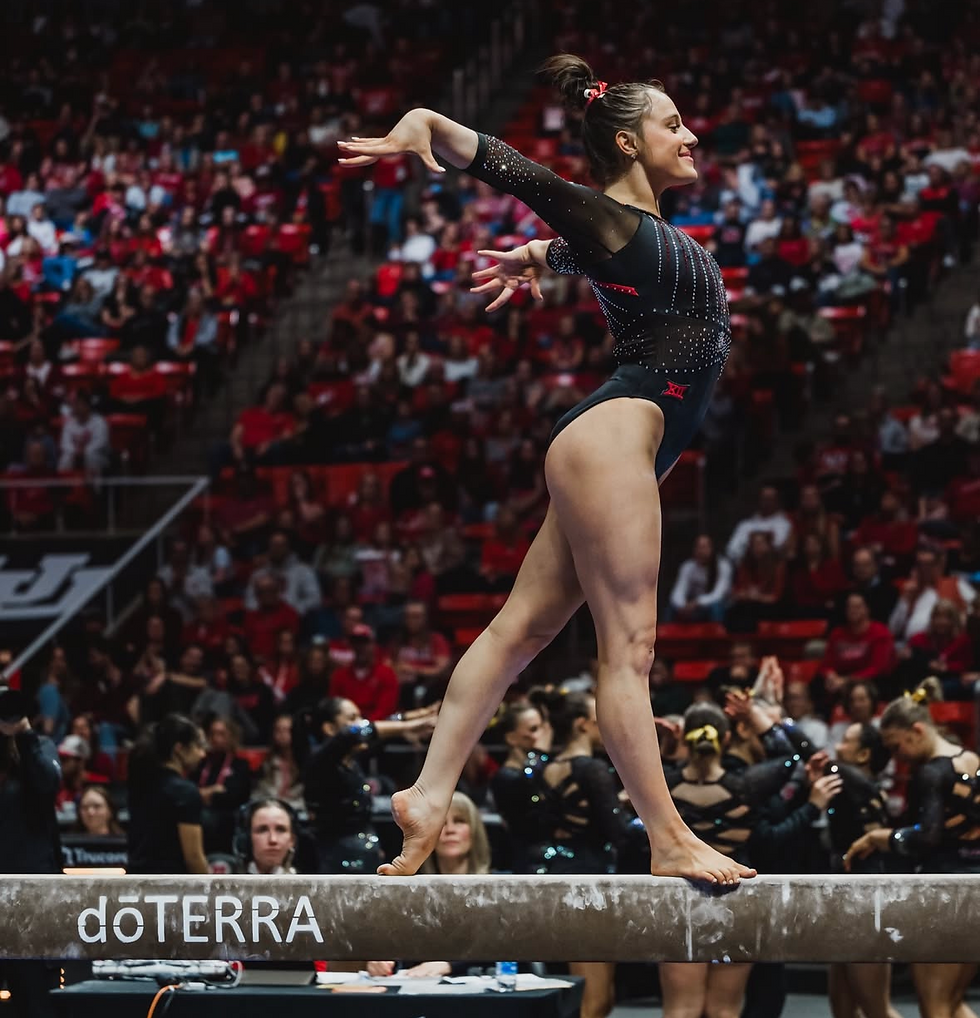 Gymnast Ella Zirbes in the middle of her routine on a beam. 