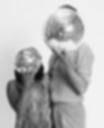 A black and white picture of Jordan Chiles and Ezra Sosa with their faces hidden by mirrorballs.