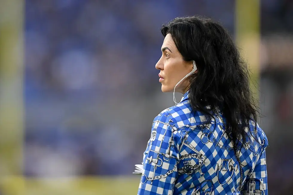 Colts owner and CEO Carlie Irsay-Gordon wearing a headset on the sidelines of a Colts preseason game