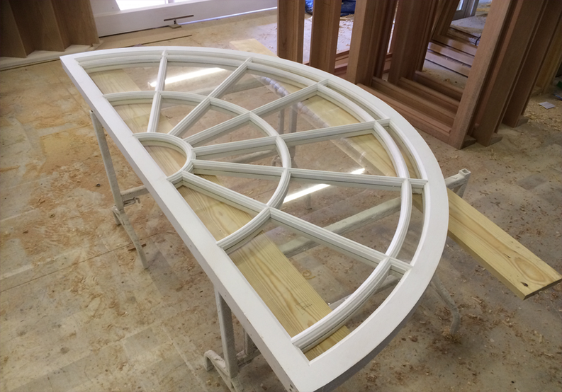 Hardwood arched fanlight, painted white