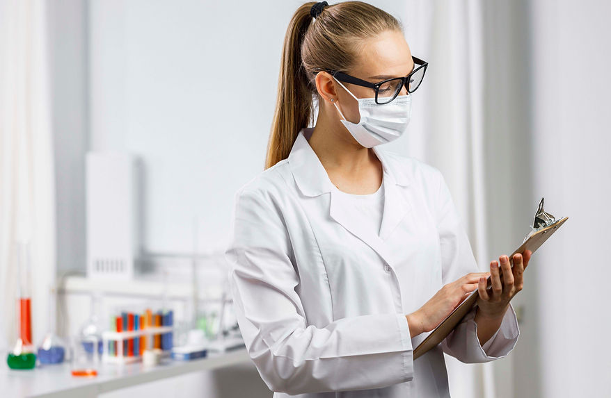 portrait-female-researcher-with-medical-mask-clipboard copy.jpg