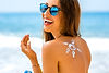 bigstock-Woman-using-sun-cream-on-the-b-94171682.jpg