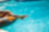 close-up-photo-woman-s-legs-swimming-pool.jpg